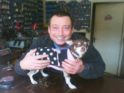 Queenie Woof Woof with Grange Hill celeb Lee MacDonald AKA Zammo in his shop in Wallington Surrey